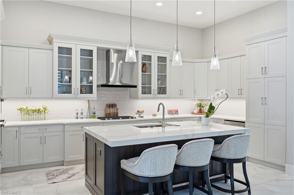 Oversized quartz island with bar seating, perfect for casual dining and entertaining.