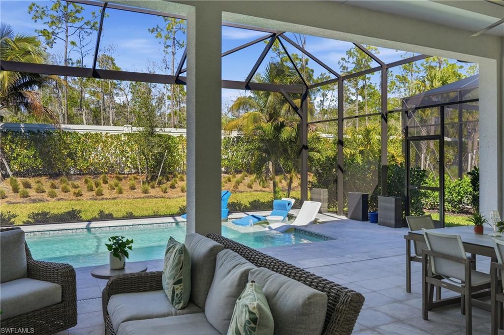 Private backyard retreat surrounded by tropical landscaping and tranquil green views.