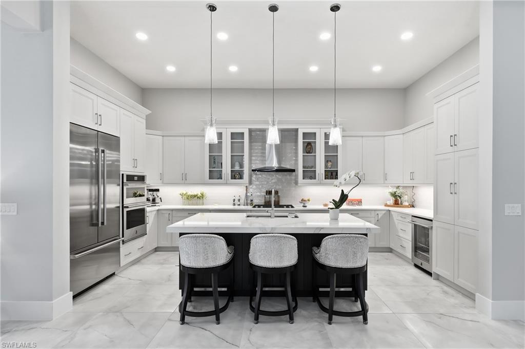 Spacious island kitchen designed for entertaining with ample prep space and seamless flow to the great room.
