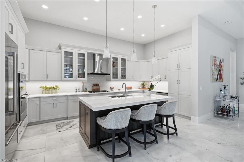 Oversized quartz island with bar seating, perfect for casual dining and entertaining.