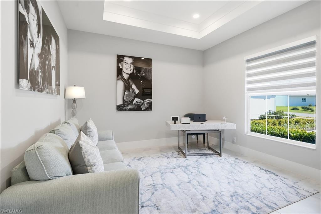 Private den with double doors, ideal for a home office, media room or optional fourth bedroom.
