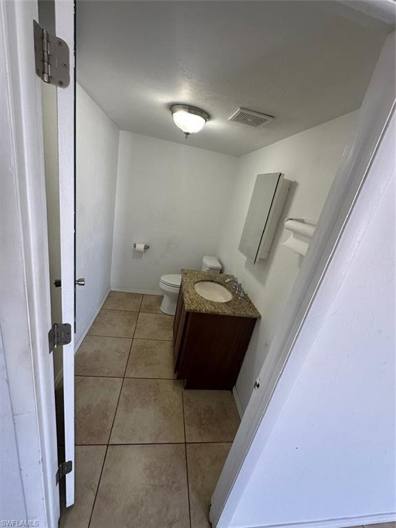 Bathroom featuring vanity and light tile patterned flooring