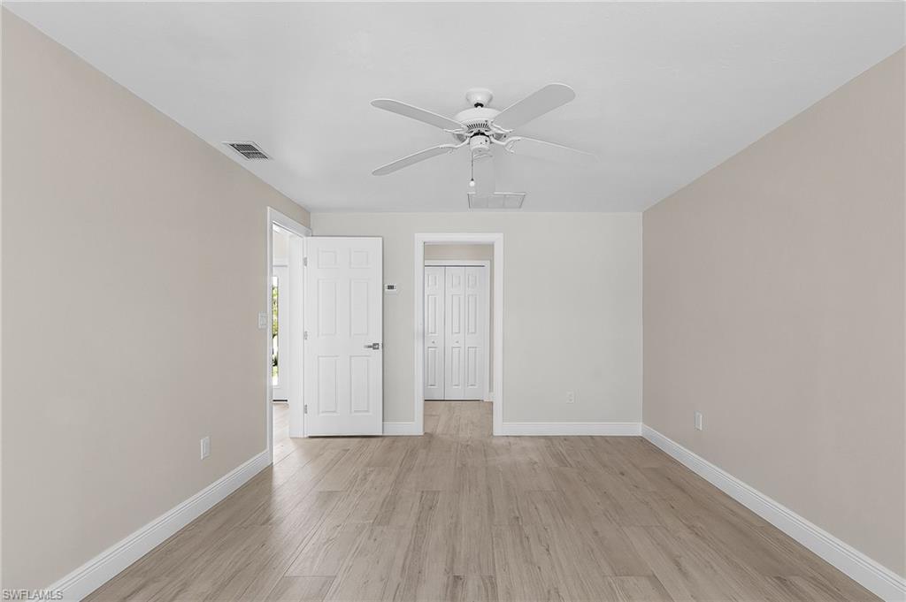 Bedroom featuring light wood-style flooring and a ceiling fan