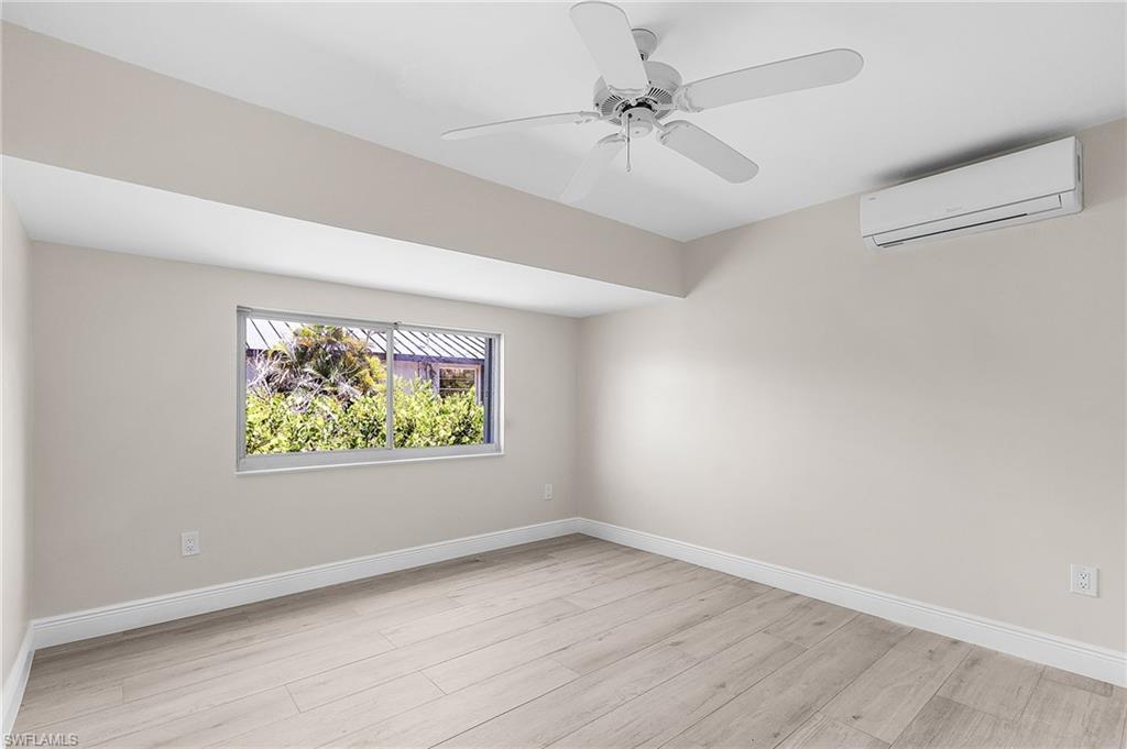 Unfurnished bedroom featuring ceiling fan and light wood-style floors