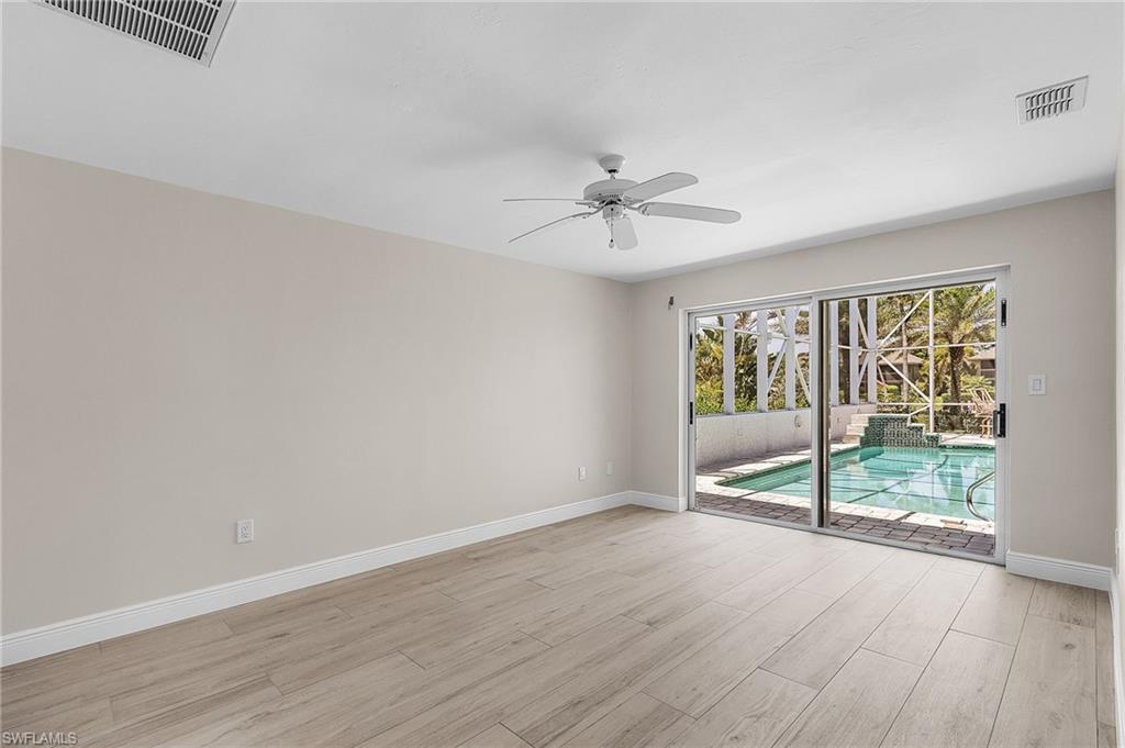 Bedroom with a ceiling fan and light wood-style floors