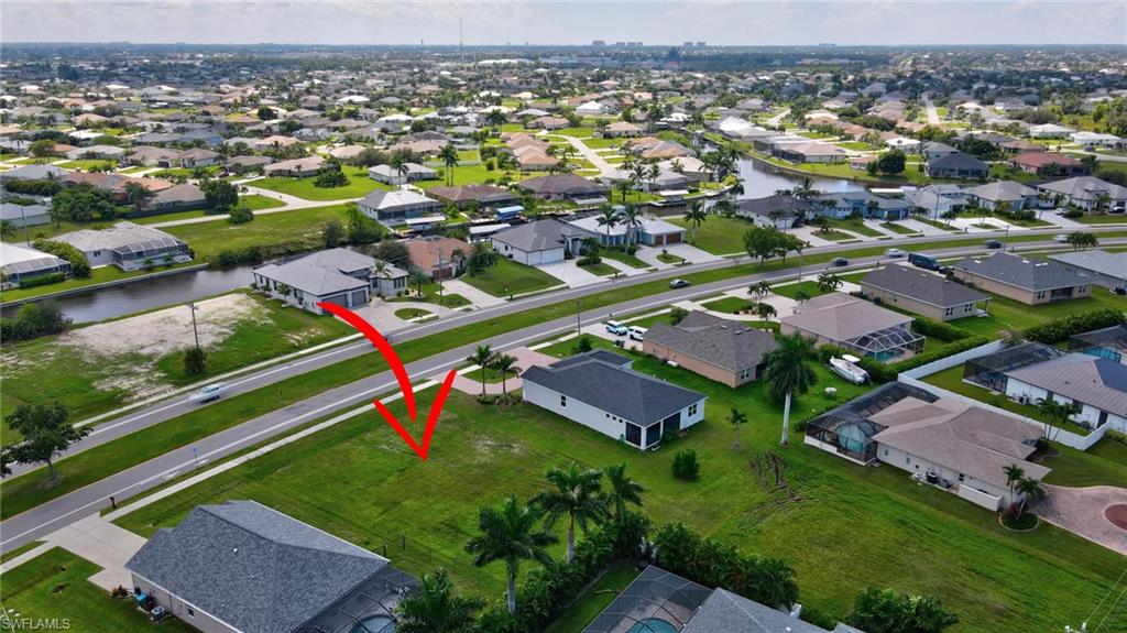 View of property location with nearby suburban area