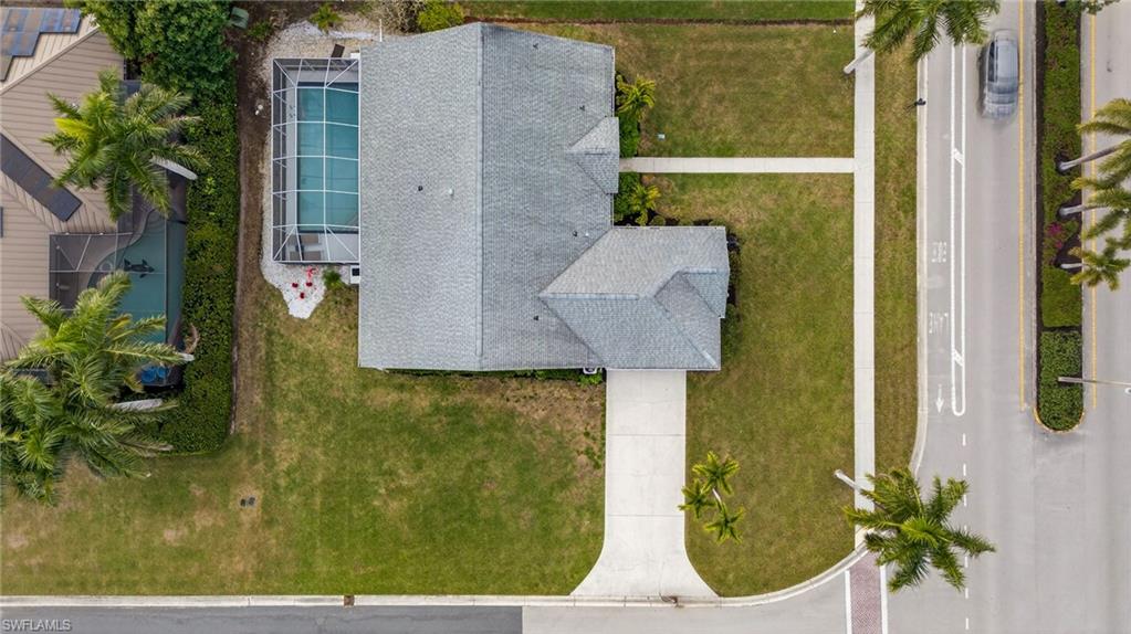 Aerial view of property and surrounding area with a pool area