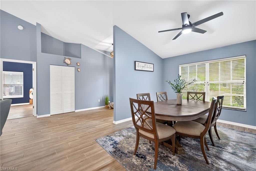 Dining room featuring wood-style flooring, and a ceiling fan