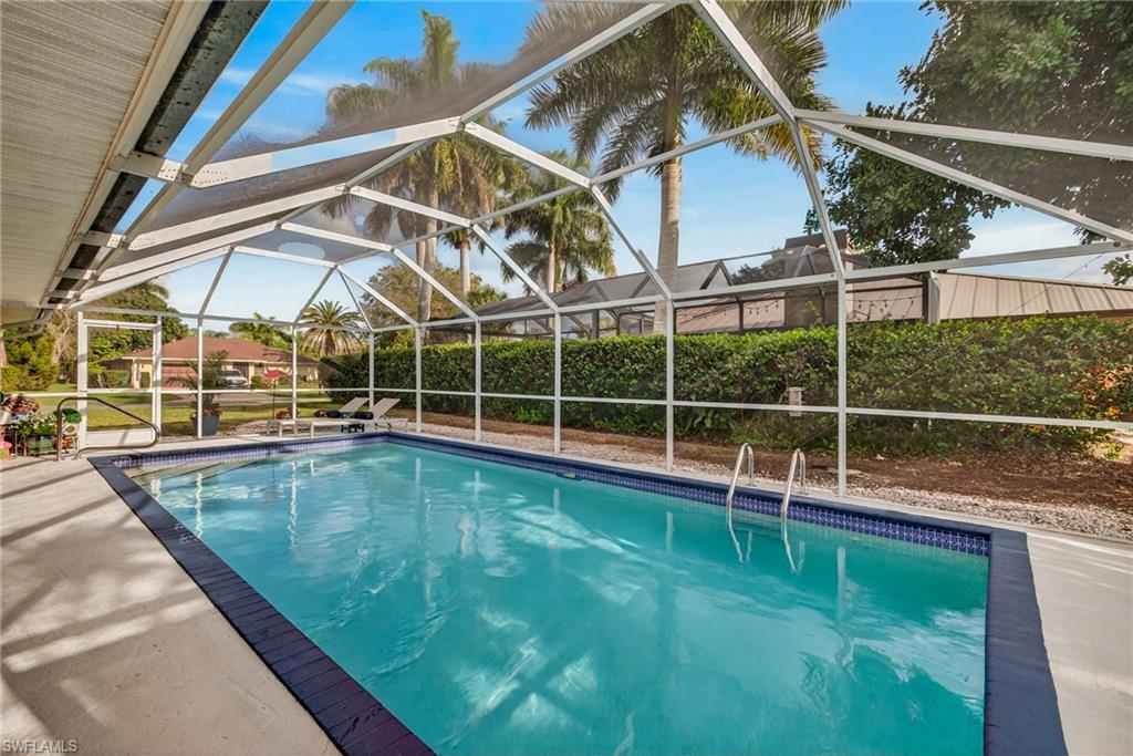 View of swimming pool with screen enclosure