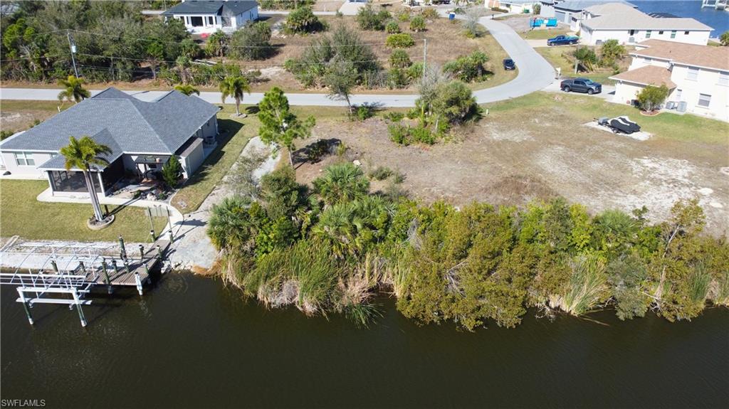 Aerial perspective of suburban area with a large body of water