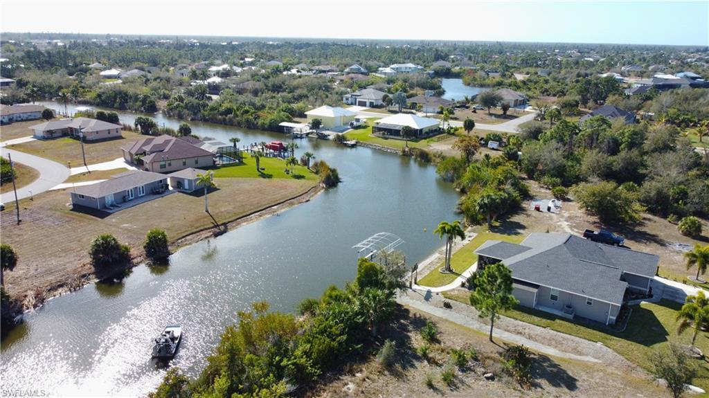 Aerial perspective of suburban area with a large body of water