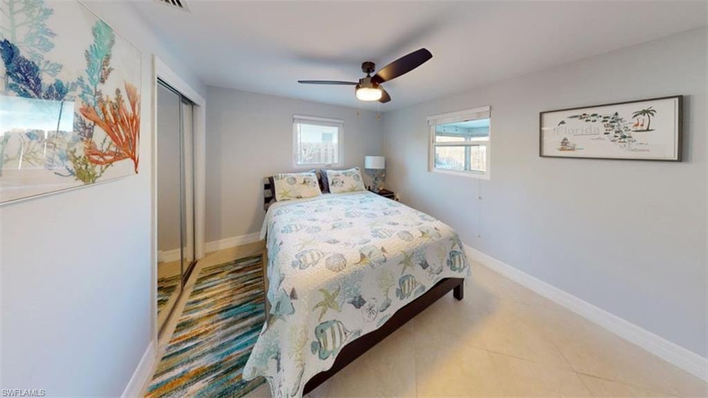 Bedroom featuring a closet and ceiling fan