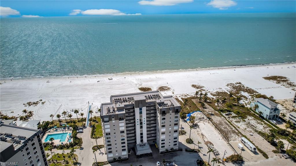 Aerial view of extended coastline and a pool