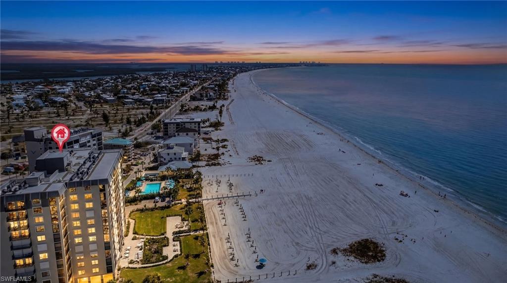 Aerial view at dusk of view of water and beach