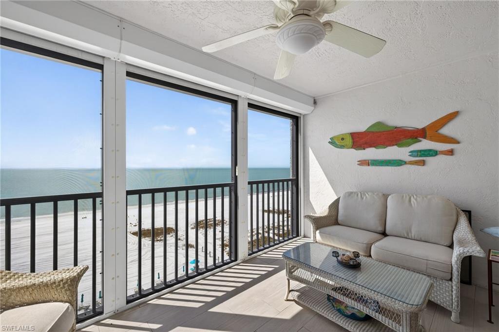 Balcony with view of water and beach