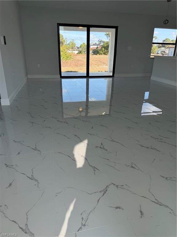Unfurnished room with plenty of natural light