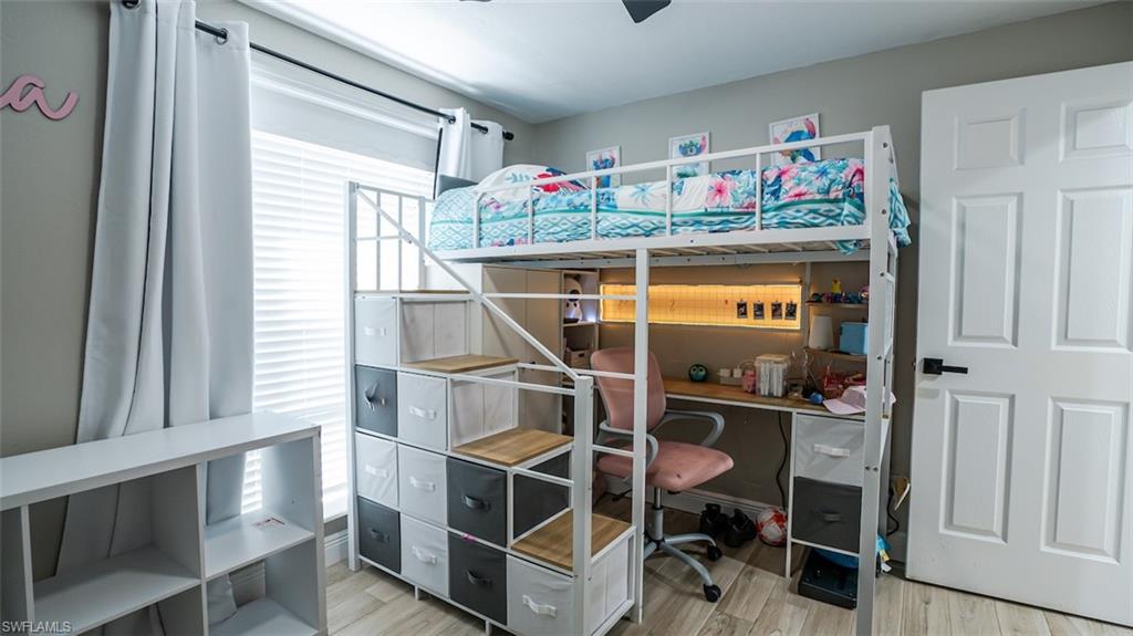 Bedroom with light wood-type flooring and ceiling fan