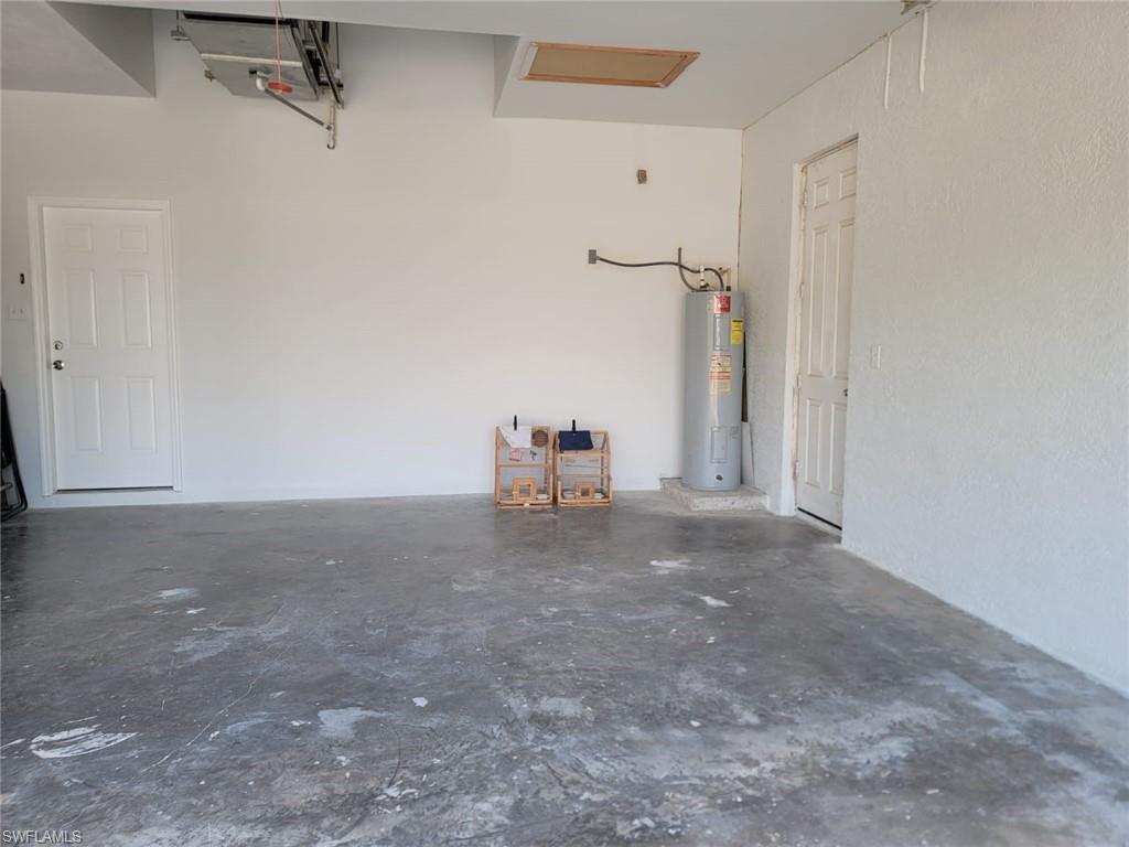 Garage featuring water heater