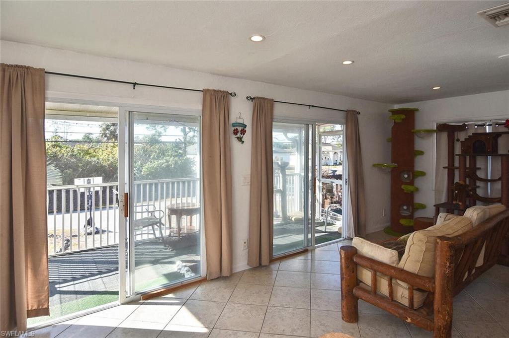 Doorway to outside featuring recessed lighting and tile patterned floors