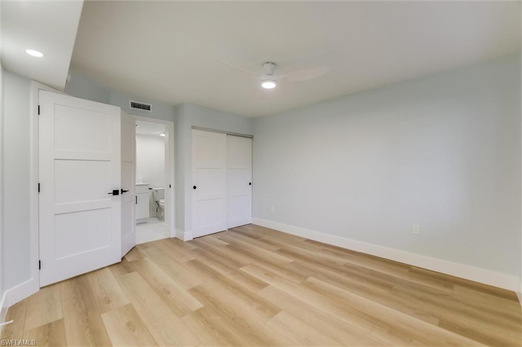 Unfurnished bedroom with light wood finished floors, a closet, a ceiling fan, and recessed lighting