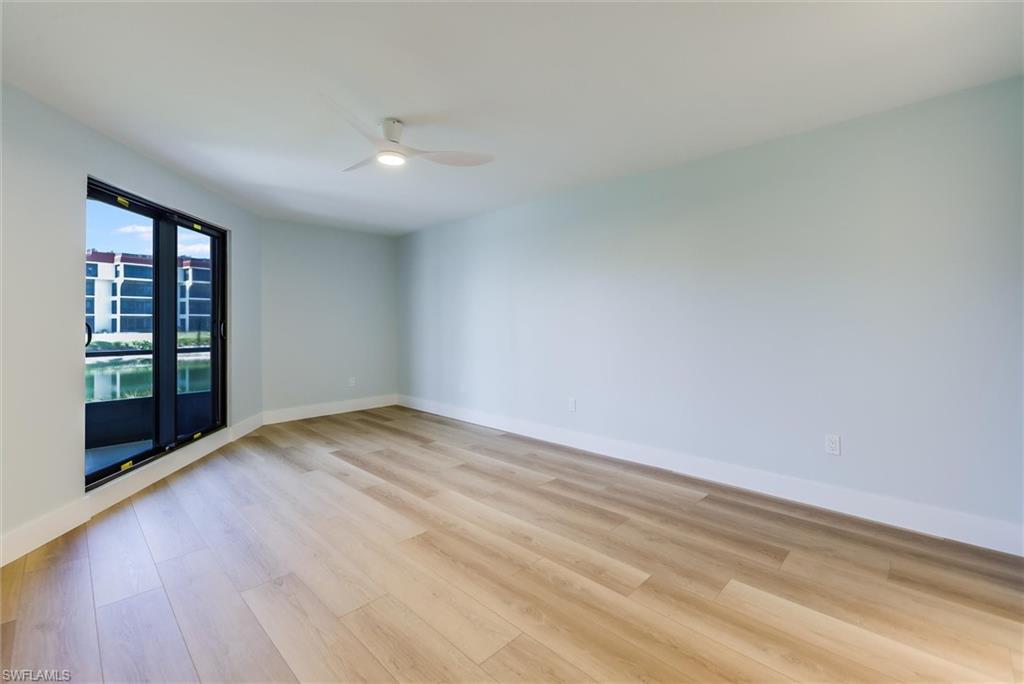 Unfurnished room with light wood-style floors and a ceiling fan