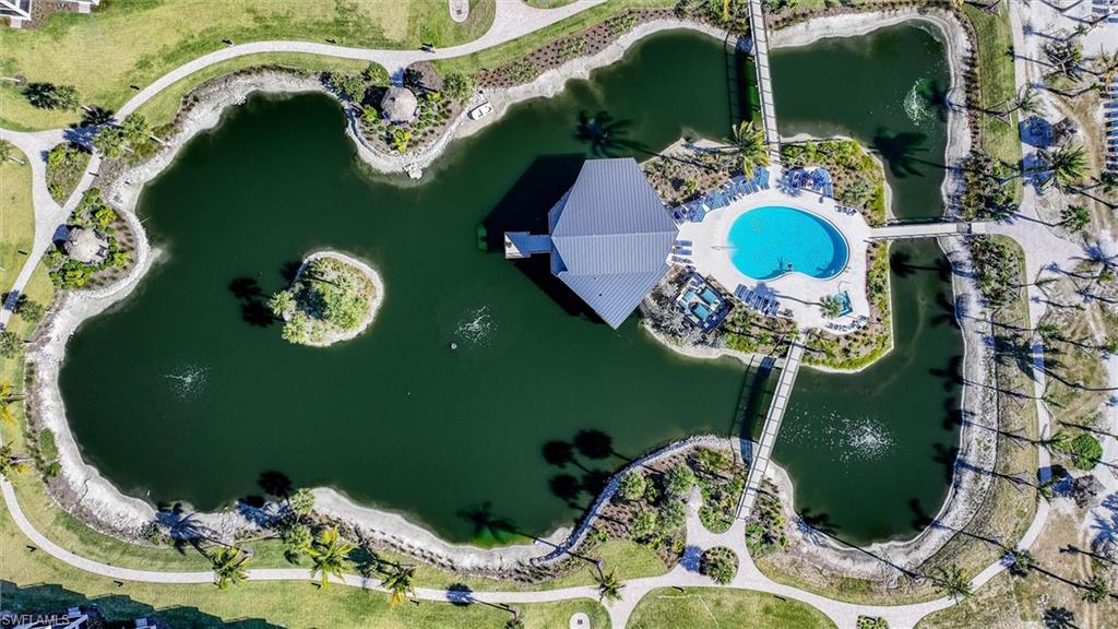 Aerial view of property's location featuring a large body of water