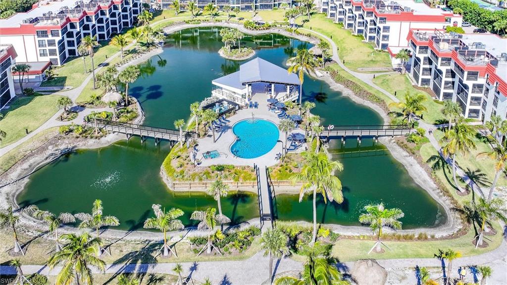 Bird's eye view of a nearby body of water and apartment complex