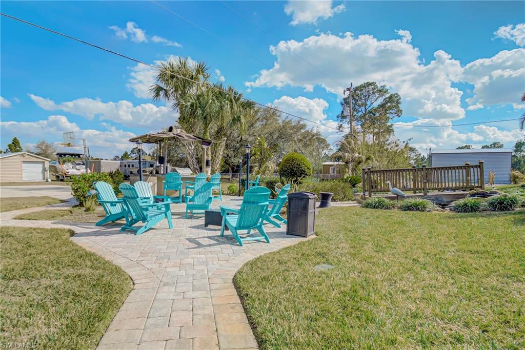 View of green lawn featuring a patio area