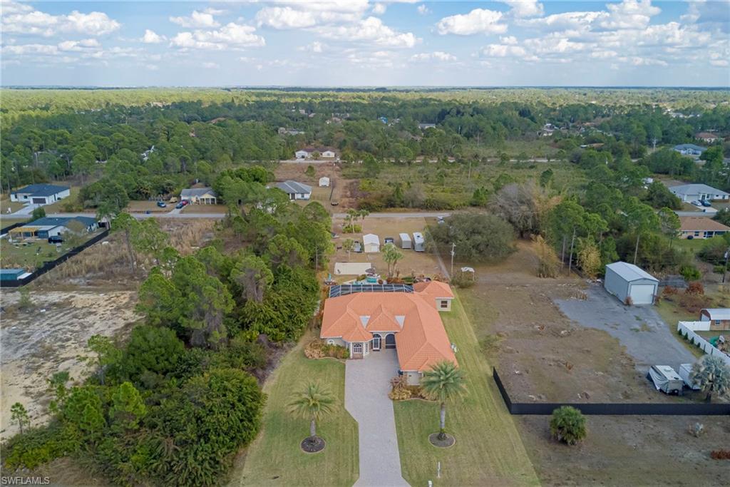 View of property location with nearby suburban area