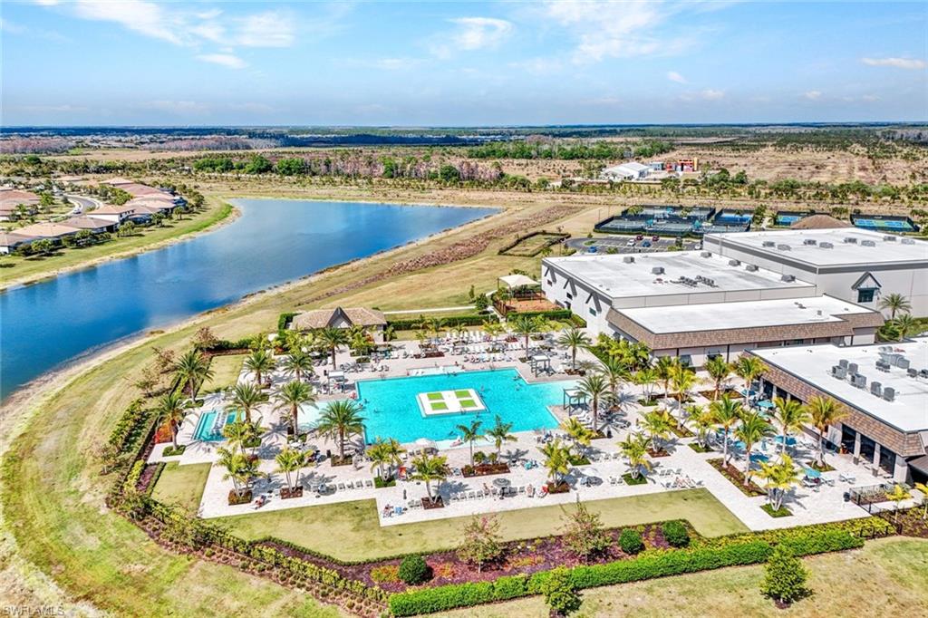 Bird's eye view of a pool and a nearby body of water