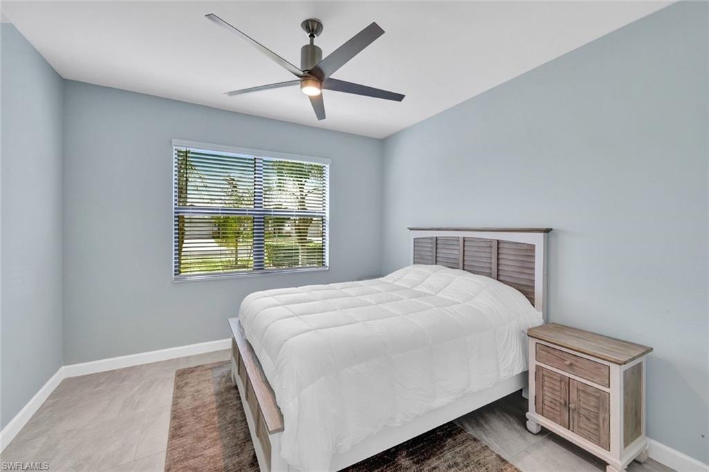 Bedroom featuring baseboards and ceiling fan
