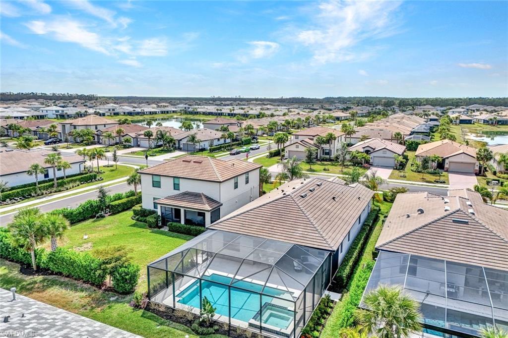 Aerial view of residential area featuring a pool area