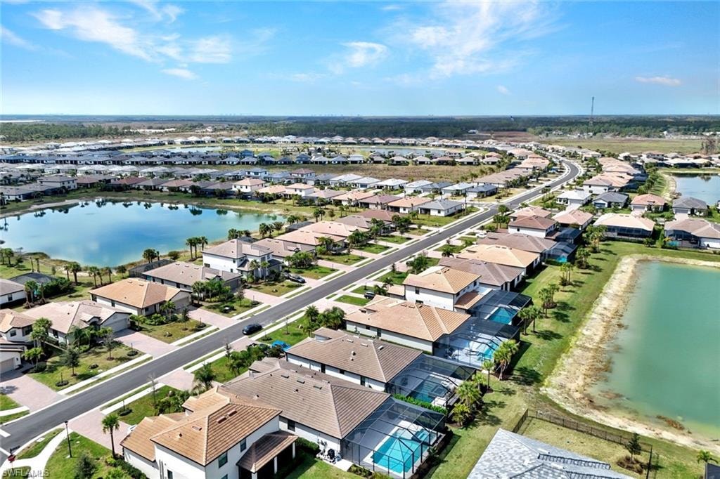 Aerial view of residential area featuring a large body of water