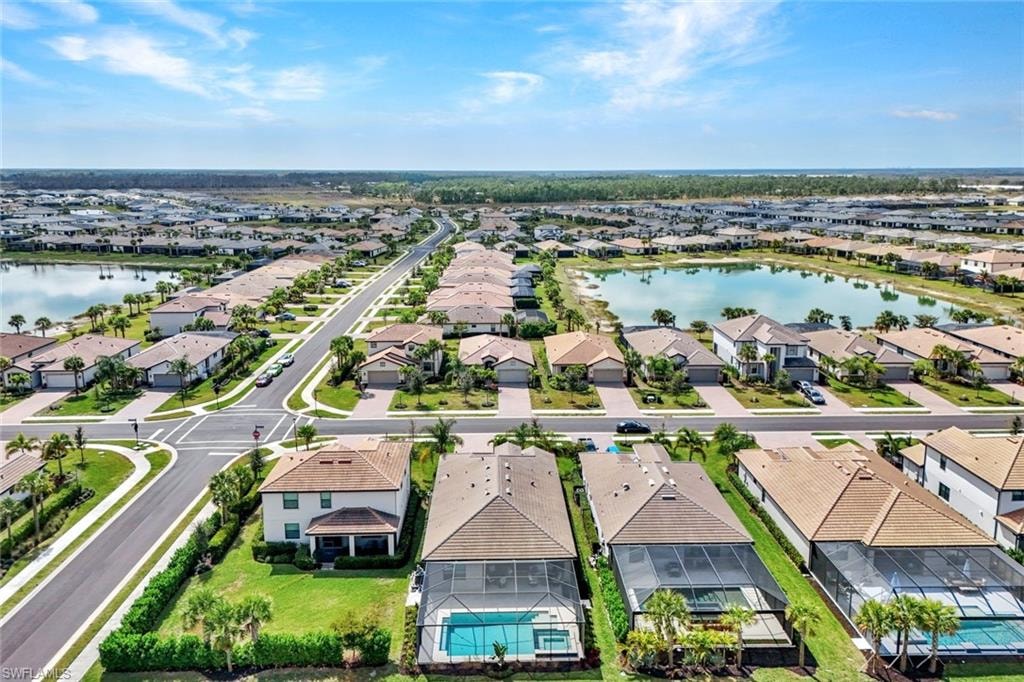 Aerial perspective of suburban area with a large body of water