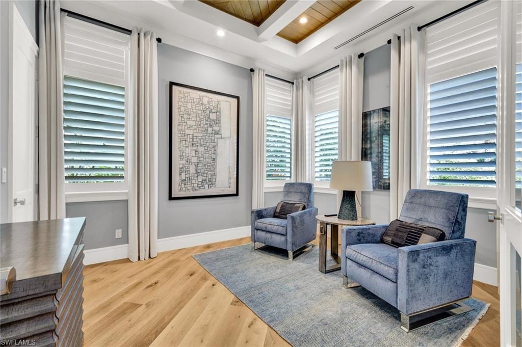 Living area with light wood-style floors, recessed lighting, and wood ceiling