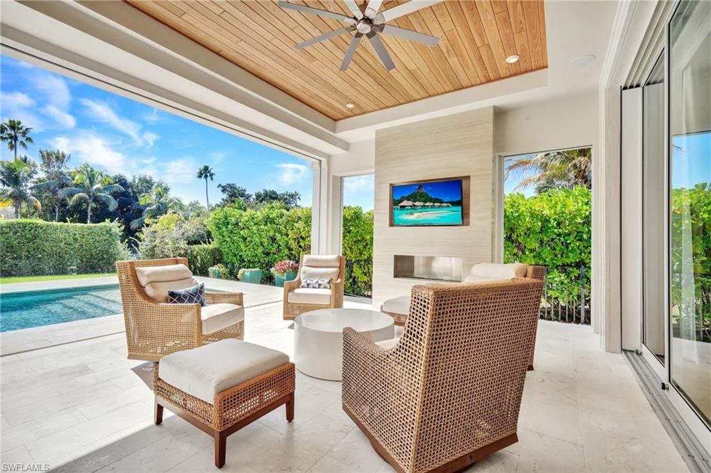 View of patio / terrace with a ceiling fan and outdoor seating