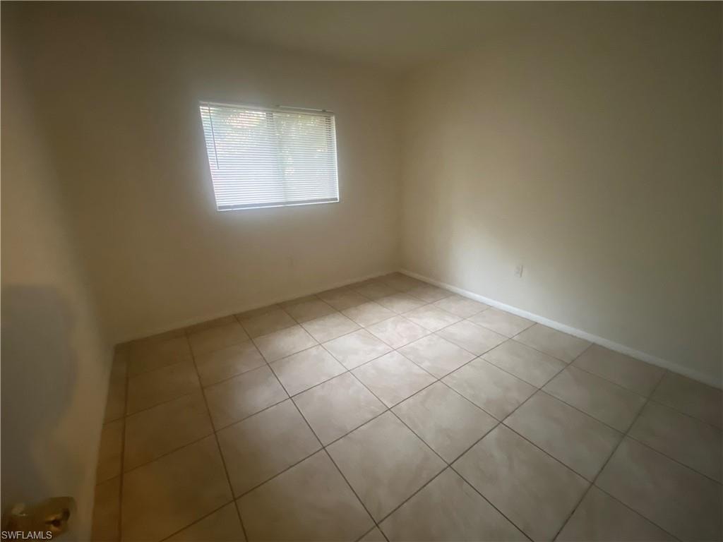Spare room featuring light tile patterned floors
