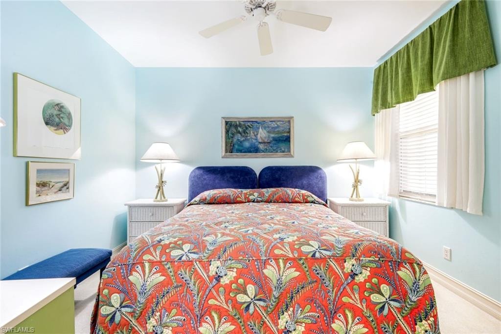Guest Bedroom #1 with a ceiling fan and baseboards
