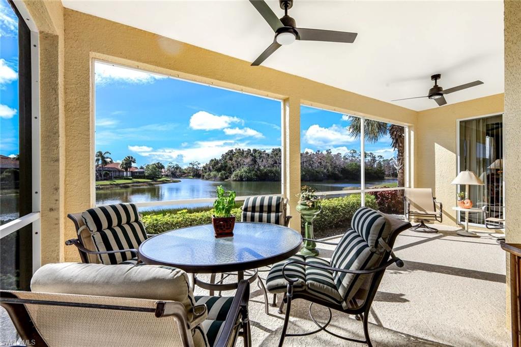 Lanai featuring a water view and a textured wall