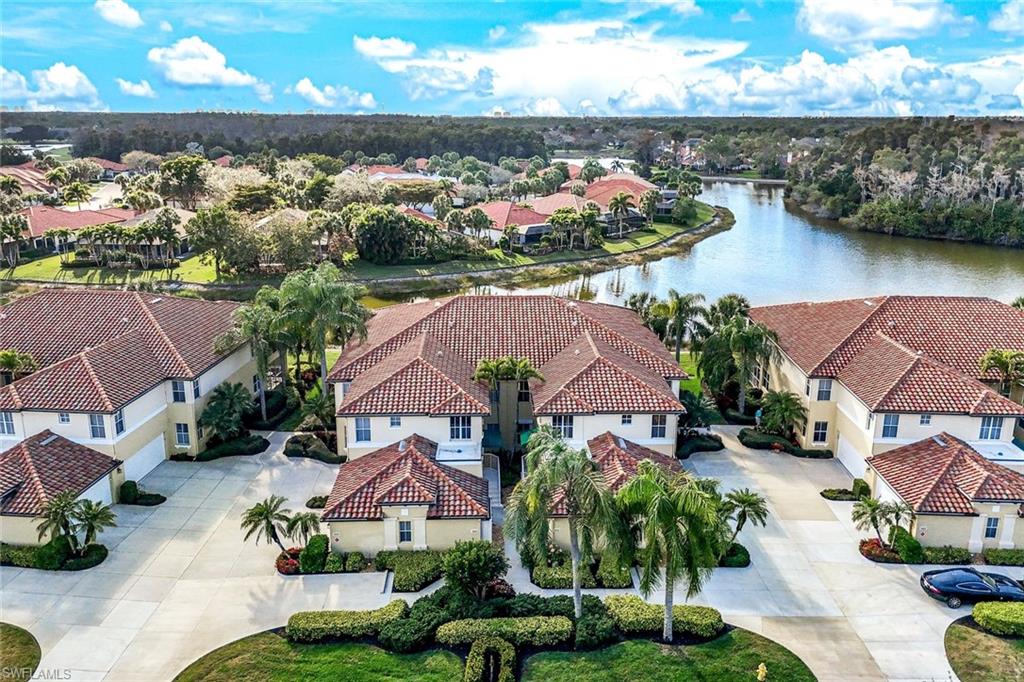 Aerial perspective of suburban area with a nearby body of water