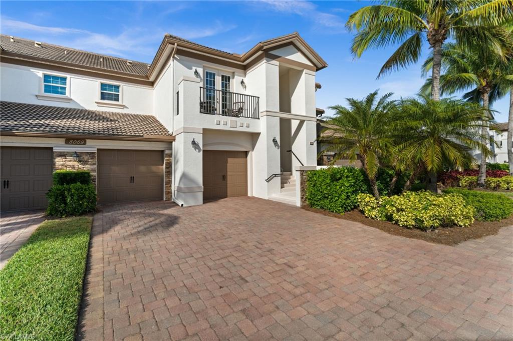 Front Entrance showing balcony, two car garage and gorgeous pillared entryway