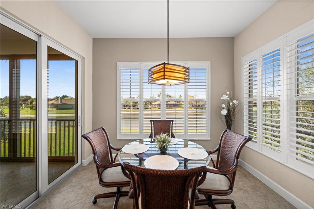 Dinette with beautiful views bright with light streaming in from slider and windows, windows have new planation shutters!