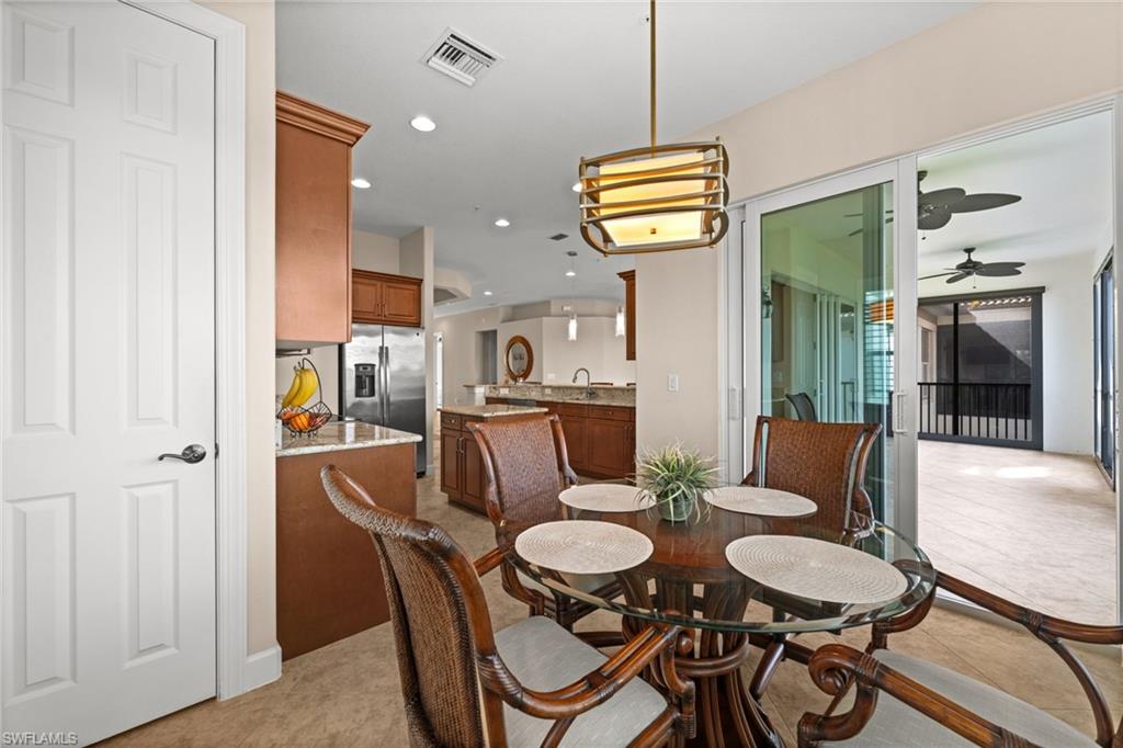 Dining area with slider to lanai complete with gorgeous lake views