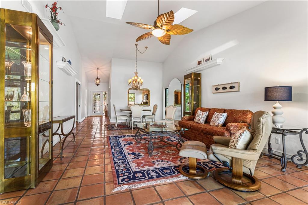 Living area has vaulted ceiling, skylights, ceiling fan and so much room!