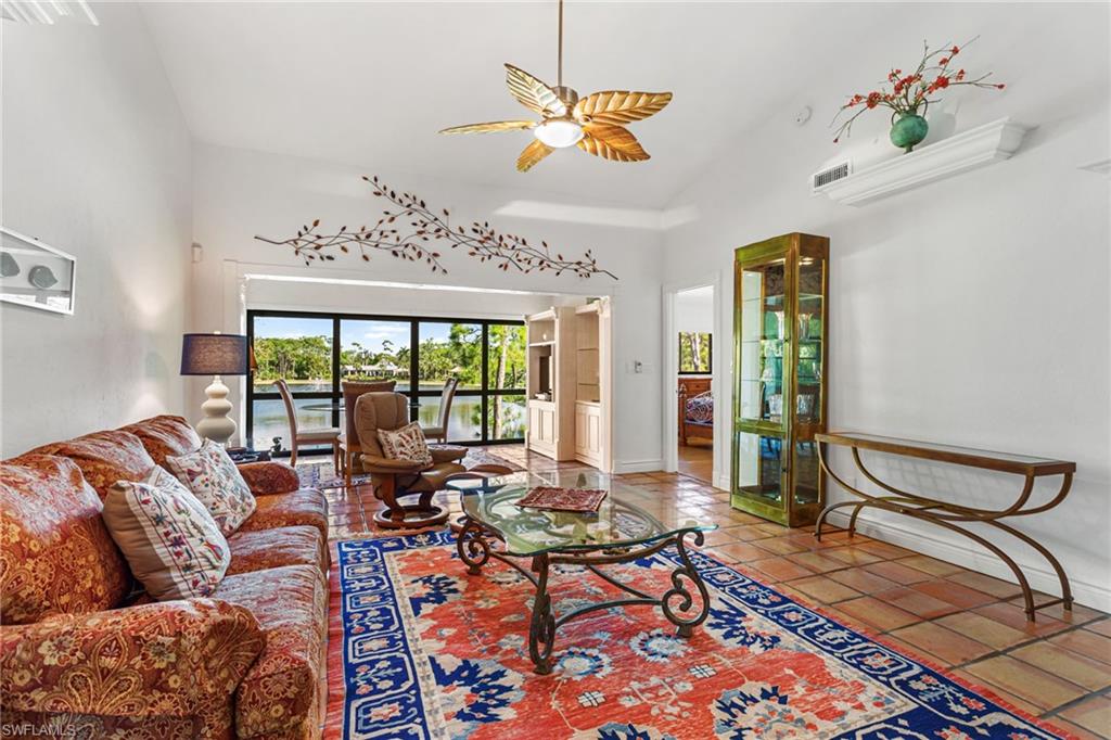 Living area has vaulted ceiling, skylights, ceiling fan and so much room!