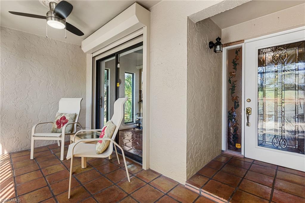 Entrance to unit featuring screened balcony