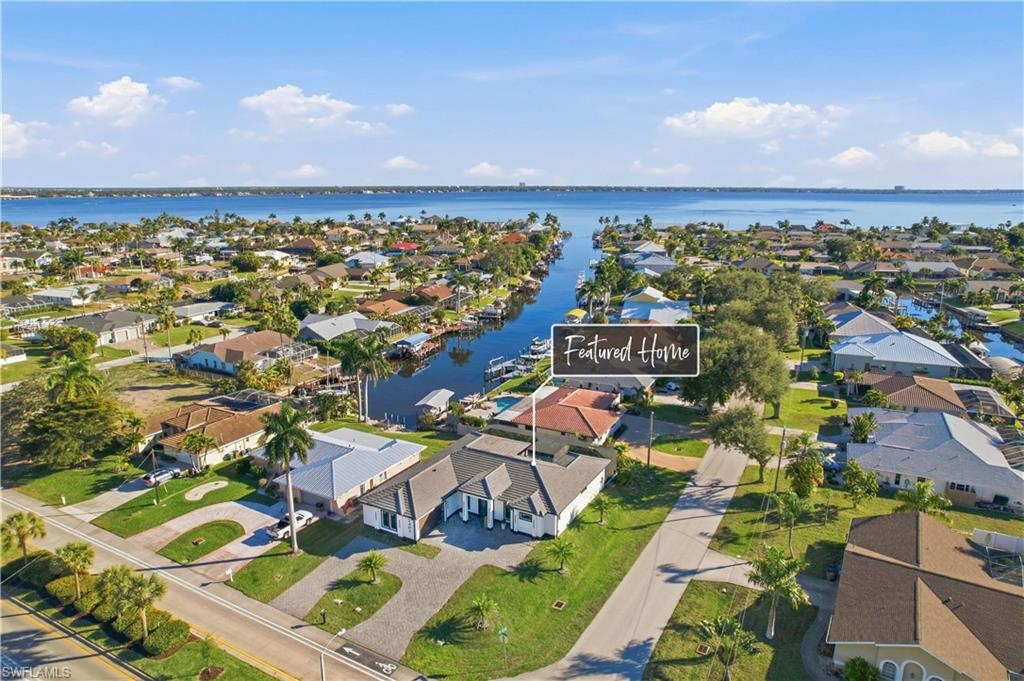 Aerial perspective of suburban area with a nearby body of water