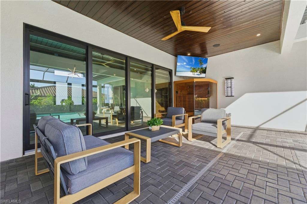 View of patio / terrace with a ceiling fan and outdoor lounge area