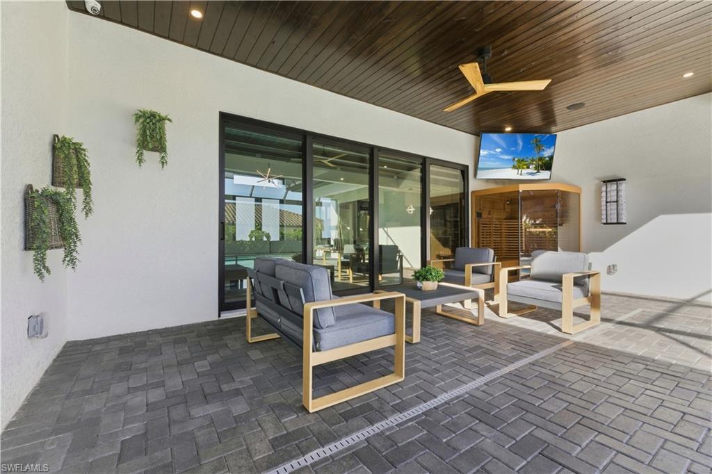 View of patio / terrace featuring ceiling fan and outdoor seating