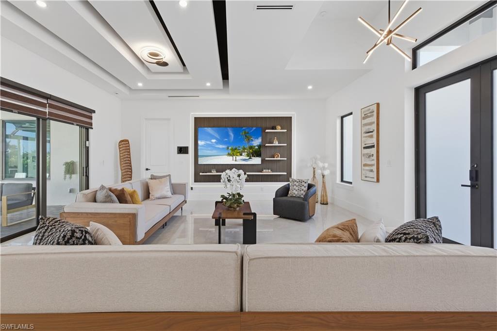 Living room with a chandelier and french doors